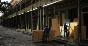 Photo: Residents travel on a jet ski as Ida storm surge floods Mississippi town